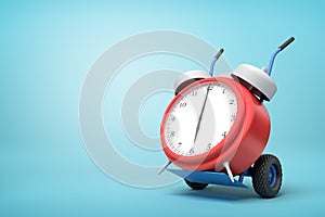 3d rendering of alarm clock on a hand truck on blue background