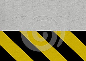 3d rendering. black and yellow caution line on cement wall background