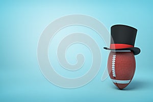 3d rendering of brown oval ball wearing black tophat with much copy space on the rest of light blue background.