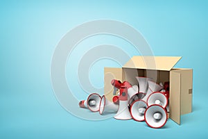 3d rendering of cardboard box lying sidelong full of red and white megaphones on light-blue background with much copy