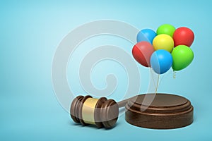 3d rendering of colorful balloons on round wooden block and brown wooden gavel on blue background