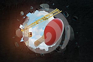 3d rendering of construction crane and ping pong racket seen through black wall hole
