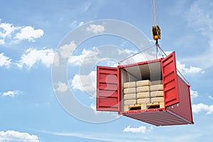 3d rendering of crane lifting open red shipping container filled with packs and wooden pallets on blue sky background