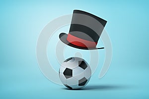 3d rendering of football and black tophat floating in air above ball on light blue background.