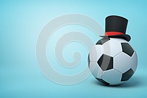 3d rendering of football wearing black tophat with much copy space on the rest of light blue background.