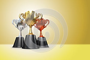 3D rendering gold, silver and bronze awards winners cup sitting