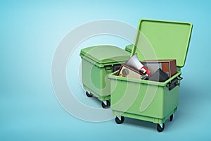 3d rendering of green trash bins with vintage tv set, radio and megaphone inside on blue background.