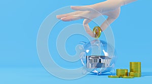 3d rendering A hand picks up a gold coin and puts it in a glass piggy bank with a house inside. concept of saving money to buy a