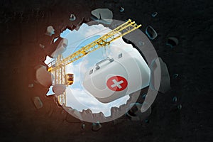 3d rendering of hoisting crane carrying medical bag and breaking wall leaving hole with blue sky seen through.