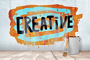 3d rendering of paint brush and bucket with `CREATIVE` sign on colorful background