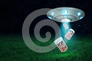 3d rendering of silver metal UFO with medical pills jars on dark night sky and green grass background