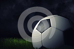 3d rendering of a single football ball on a dark grass field under bright spotlight.