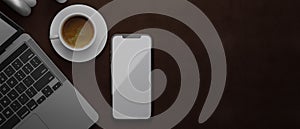 3D rendering, smartphone with mock-up screen on brown leather background with laptop and coffee cup, top view
