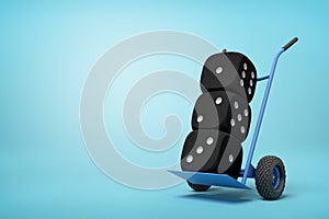 3d rendering of three black casino dice on a hand truck on blue background
