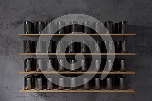 3d rendering of tin cans closely spaced on wooden shelf