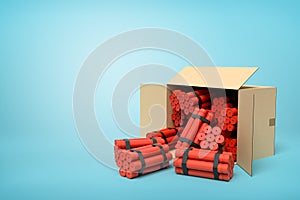 3d rendering of tnt dynamite sticks in carton box on blue background.
