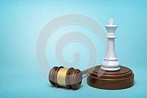 3d rendering of white chess king standing on sounding block with gavel lying beside on light-blue background.