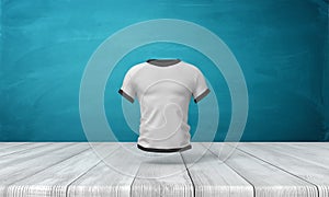 3d rendering of white close-fitting men`s T-shirt with black edge piping, suspended in air above wooden surface on blue