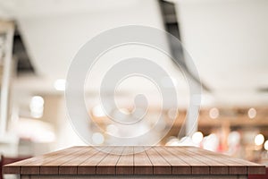 3D Rendering, Wooden top table with bokeh light effect and blur restaurant on background, blur background