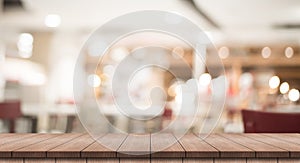 3D Rendering, Wooden top table with bokeh light effect and blur restaurant on background, blur background