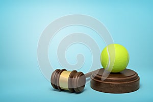 3d rendering of yellow tennis ball on round wooden block and brown wooden gavel on blue background