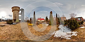 3D spherical panorama of landscape with snow, pines, water tower with 360 degree viewing angle. Ready for virtual reality in vr.