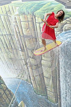 3D street art, woman in red dress flies on