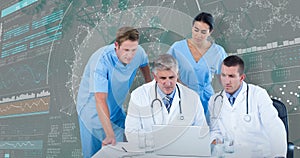 3DComposite image of team of doctors using laptop at desk