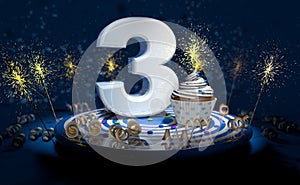 3th birthday or anniversary cupcake with big white number with yellow streamers on blue table with dark background full of sparks