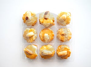 3x3 small cookies in transparent plastic box on white background