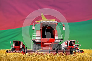 4 bright red combine harvesters on rye field with flag background, Burkina Faso agriculture concept - industrial 3D illustration