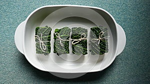 4 Cabbage rolls. Cabbage, a vitamin-rich main course. Close up,  on white background