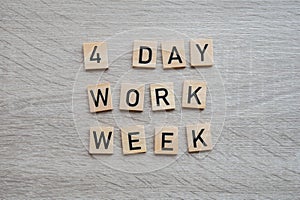 4 day work week symbol on wooden blocks four day working week concept. Modern approach doing business short workweek
