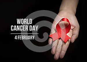 4 February , World Cancer Day with ribbon on human hand for campaign poster about cancer