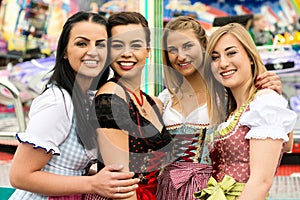 4 gorgeous young women at German funfair