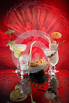 4 happy umbrella drinks on red