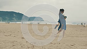 4 k beautifull young girl, mother walking and taking time with her cute little baby, among the Cantabrian coast, in the