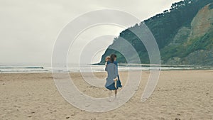 4 k beautifull young girl, mother walking and taking time with her cute little baby, among the Cantabrian coast, in the