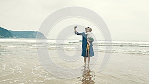 4 k beautifull young girl, mother walking and taking time with her cute little baby, among the Cantabrian coast, in the