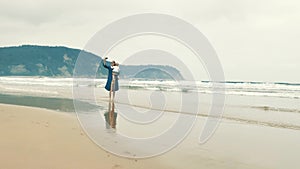 4 k beautifull young girl, mother walking and taking time with her cute little baby, among the Cantabrian coast, in the