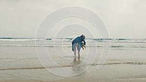 4 k beautifull young girl, mother walking and taking time with her cute little baby, among the Cantabrian coast, in the