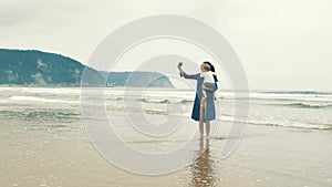 4 k beautifull young girl, mother walking and taking time with her cute little baby, among the Cantabrian coast, in the