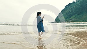 4 k beautifull young girl, mother walking and taking time with her cute little baby, among the Cantabrian coast, in the