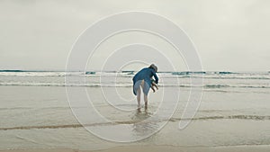 4 k beautifull young girl, mother walking and taking time with her cute little baby, among the Cantabrian coast, in the