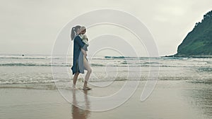 4 k beautifull young girl, mother walking and taking time with her cute little baby, among the Cantabrian coast, in the