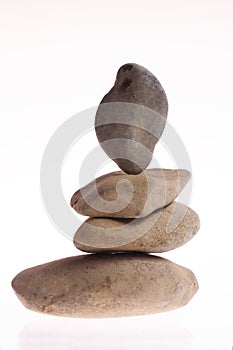 4 stones on a white background