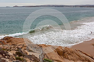 4 surfers at Knights beach located at Port Elliot on the fleurieu peninsula south australia on 3rd april 2019