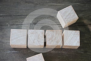 4 Wood Blocks Top View, On Wooden Table, polished wooden table background