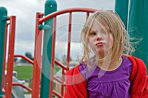 4 Year Old Girl Upset and Pouting at Playground