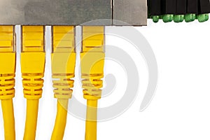 4 yellow UTP patch cords connected in ethernet switch, with top view.